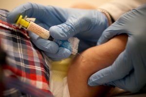 In this file photo, a doctor delivers a flu vaccination to an infant's leg at the Miami Children's Hospital on Jan. 7, 2015 in Coral Gables, Florida. (Credit: Joe Raedle/Getty Images)