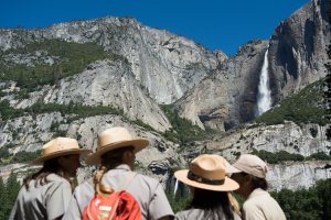 Park rangers meet in front of Yosemite Falls before President Barack Obama's speech in Yosemite National Park on June 18, 2016. (Credit: David Calvert / Getty Images)