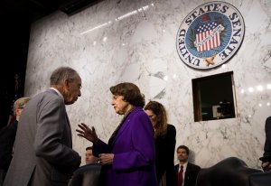 From left: Senate Judiciary Committee chairman Sen. Chuck Grassley speaks with ranking member Sen. Dianne Feinstein before a hearing on foreign agents' attempts to influence U.S. elections on Capitol Hill, July 27, 2017. (Credit: Drew Angerer / Getty Images)