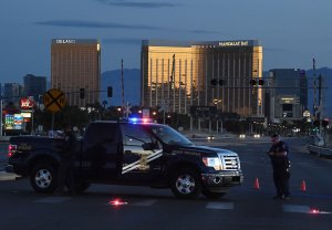 Police form a perimeter around the road leading to the Mandalay Hotel after a gunman opened fire on a country music concert in Las Vegas, Nevada on Oct. 2, 2017. (Credit: MARK RALSTON/AFP/Getty Images)