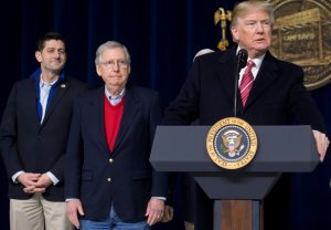 Donald Trump speaks alongside Speaker of the House Paul Ryan, left, and Senate Majority Leader Mitch McConnell, center, during a retreat with Republican lawmakers and members of his Cabinet at Camp David in Thurmont, Maryland on Jan. 6, 2018. (Credit: SAUL LOEB/AFP/Getty Images)