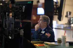 Traders work on the floor at the closing bell of the Dow Industrial Average at the New York Stock Exchange on January 11, 2018 in New York. (Credit: BRYAN R. SMITH/AFP/Getty Images)
