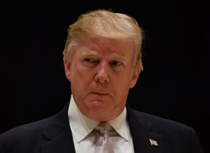 US President Donald Trump speaks to reporters at Trump International Golf Club in West Palm Beach on January 14, 2018. (Credit: NICHOLAS KAMM/AFP/Getty Images)