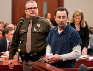 Dr. Larry Nassar is led to the witness box during his sentencing hearing in Lansing, Michigan, Jan. 16, 2018. (Credit: GEOFF ROBINS/AFP/Getty Images)