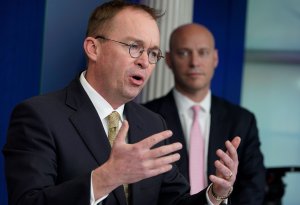 Office of Management and Budget Director Mick Mulvaney, left, speaks as Legislative Affairs Director Marc Short looks on during a press briefing in the White House on Jan. 20, 2018. (Credit: Mandel Ngan / AFP / Getty Images)