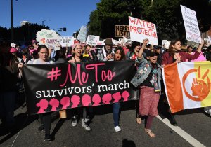 Protesters march during the Women's Rally on the one-year anniversary of the first Women's March, when millions marched around the world to protest U.S. President Donald Trump's inauguration, in Los Angeles on Jan. 20, 2018. (Credit: Mark Ralston/AFP/Getty Images)