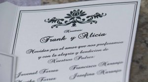 An invite for the wedding of Frank Naranjo and Alicia Torres, which had to be canceled after a fire at the church it was to be held in, is seen on Jan. 25, 2018. (Credit: KTLA)