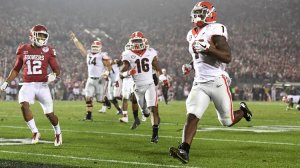 Georgia running back Sony Michel scores the game-winning touchdown in the second overtime of the College Football Playoff semifinal on Monday at the Rose Bowl. (Credit: Wally Skalij / Los Angeles Times)