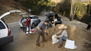 People living in Kagel Canyon in the Sunland area, where recent wildfires have left charred land vulnerable to mudslides, fill up sand bags at a fire station on Jan. 7, 2018, to prepare for a coming rainstorm. (Credit: Wally Skalij / Los Angeles Times)