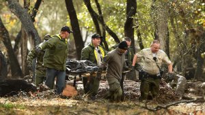 Sheriffs deputies carry a body from the debris near Hot Springs Road in Montecito after a major storm hit the burn area Tuesday. (Credit: Wally Skalij / Los Angeles Times) 