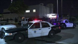 Officers investigate the scene of a police shooting in Long Beach on Jan. 20, 2018. (Credit: KTLA)