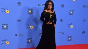 Actress and TV talk show host Oprah Winfrey poses with the Cecil B. DeMille Award during the 75th Golden Globe Awards on Jan. 7, 2018. (Credit: Frederic J. Brown/AFP/Getty Images)