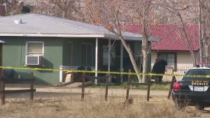 Authorities investigate a triple homicide in a Palmdale area home on Jan. 14, 2018. (Credit: KTLA)