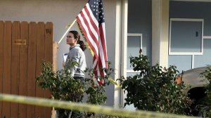 An investigator searches for evidence at the home of a retired L.A. County sheriff's deputy who was shot while answering his door on Jan. 4, 2018. (Credit: Wally Skalij / Los Angeles Times)