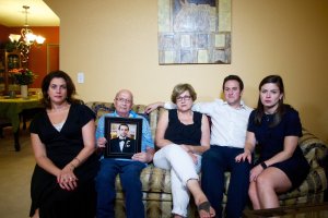 The Jabara family holds a photo of deceased relative Khalid. From left are Victoria, Mounha, Haifa, Rami and Jenna. (Credit: Mallory Simon / CNN)