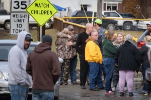 Family members and friends console each other after four people are killed at a Pennsylvania car wash. (Credit: Getty Images North America/Getty Images