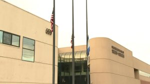 Flags were lowered outside the San Bernardino sheriff's station on Jan. 3, 2018. (Credit: KTLA)