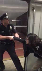 Bethany Renee Nava is seen being pulled off a Metro train on Jan. 22, 2018. (Credit: Brock Bryan)