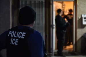 U.S. Immigration and Customs Enforcement agents make an arrest in Los Angeles in a photo released by the federal agency on Feb. 11, 2018.