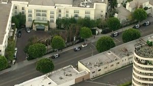 Police are seen outside the Peninsula Beverly Hills Hotel on Feb. 22, 2018. (Credit: KTLA)