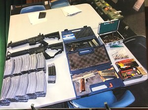 A weapons cache confiscated from the home of a 17-year-old who allegedly threatened to shoot up his Whittier-area high school is shown at a sheriff's news conference on Feb. 21, 2018. (Credit: Steve Kuzj / KTLA)