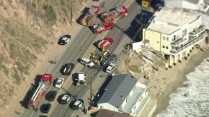 First responders work at the site of a major crash in Malibu on Feb. 7, 2018. (Credit: KTLA)