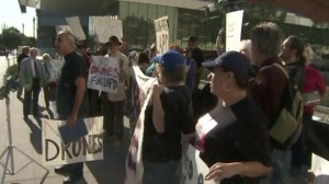 Protestors rally outside a meeting about the Los Angeles Police Department's use of drones on Feb. 7, 2018. (Credit: KTLA)