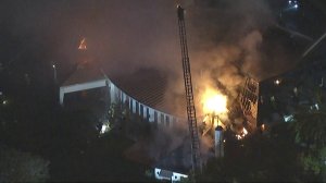 Firefighters battled a blaze at a large Bel-Air home on Feb. 8, 2018. (Credit: KTLA)