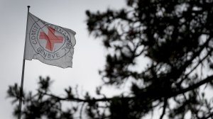 A flag floats at the top of the International Committee of the Red Cross headquarters in Geneva, Switzerland on June 4, 2014. (Credit: FABRICE COFFRINI/AFP/Getty Images)