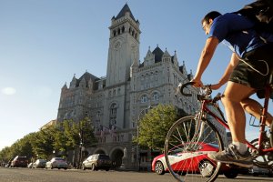 Morning traffic flows past the Trump International Hotel in Washington, DC, on its first day of business, Sept. 12, 2016. (Credit: Chip Somodevilla / Getty Images)