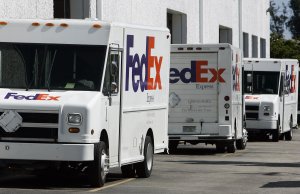 Fedex trucks sit outside a distribution site on Nov. 9, 2006 in Miami, Florida. (Credit: ROBERT SULLIVAN/AFP/Getty Images)