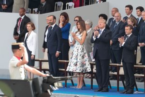 From right: French President Emmanuel Macron, President Donald Trump, First lady Melania Trump, French Prime Minister Edouard Philippe and French Defense Minister Florence Parly attend the annual Bastille Day military parade on the Champs-Elysees avenue in Paris, July 14, 2017. (Credit: Joel Saget / AFP / Getty Images)