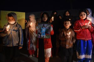 Pakistani members of the Hazara community hold a vigil in tribute to Zainab, who was raped and murdered in the city of Kasur in Punjab province, in Quetta on Jan. 11, 2018. (Credit: Banaras Khan / AFP / Getty Images)