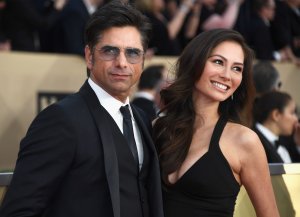Actor John Stamos, left, and Caitlin McHugh attend the Screen Actors Guild Awards at The Shrine Auditorium on Jan. 21, 2018. (Credit: Frazer Harrison / Getty Images)