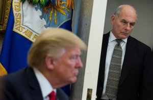 Chief of Staff John Kelly looks on as President Donald Trump meets with North Korean defectors in the Oval Office at the White House in Washington, DC on February 2, 2018. (Credit: ANDREW CABALLERO-REYNOLDS/AFP/Getty Images)