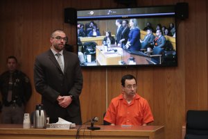 Larry Nassar sits with his attorney Matt Newburg as he is sentenced by Judge Janice Cunningham for three counts of criminal sexual assault in Eaton County Circuit Court on Feb. 5, 2018, in Charlotte, Mich. (Credit: Scott Olson/Getty Images)