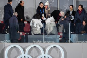 North Korea's Kim Jong Uns sister Kim Yo Jong (C) shakes hand with South Korea's President Moon Jae-in during the opening ceremony of the Pyeongchang 2018 Winter Olympic Games on February 9, 2018. (Credit: MARTIN BUREAU/AFP/Getty Images)