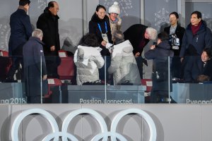 North Korea's Kim Jong Uns sister Kim Yo Jong (C) shakes hand with South Korea's President Moon Jae-in during the opening ceremony of the Pyeongchang 2018 Winter Olympic Games on February 9, 2018. (Credit: MARTIN BUREAU/AFP/Getty Images)