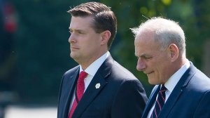 John Kelly, right, and Rob Porter walk to Marine One prior to departure from the South Lawn of the White House in Washington, D.C. on Aug. 4, 2017. (Credit: SAUL LOEB/AFP/Getty Images)