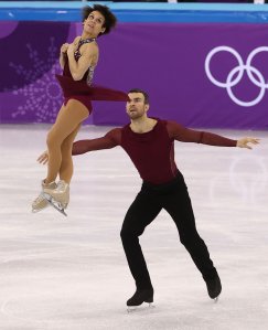 Meagan Duhamel of Canada flies up into the air as she and her skating partner, Eric Radford, compete in the Figure Skating Team Event Pairs Free Skating during the Figure Skating on day two of the PyeongChang 2018 Winter Olympic Games at Gangneung Ice Arena on Feb. 11, 2018, in Gangneung, South Korea. (Credit: Robert Cianflone/Getty Images)