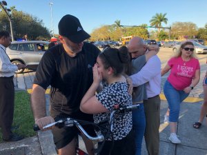 Parents and children are reunited after a deadly shooting at Marjory Stoneman Douglas High School in Parkland, Florida on Feb. 14, 2018. (Credit: Michele Eve Sandberg/AFP/Getty Images)