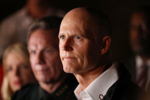 Florida Gov. Rick Scott speaks to the media as he visits Marjory Stoneman Douglas High School after a shooting at the school killed 17 people on Feb. 14, 2018 in Parkland, Florida. (Credit: Joe Raedle/Getty Images)