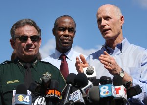 Florida Governor Rick Scott (R) speaks on Feb. 15, 2018, while standing alongside Broward County Superintendent of Schools, Robert W. Runcie, and Broward County Sheriff Scott Israel, who is on the left side, during a news conference about the mass shooting at Marjory Stoneman Douglas High School, where 17 people were killed Feb. 14, 2018, in Parkland, Fla. (Credit: Mark Wilson/Getty Images)