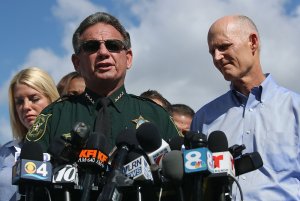 Broward County Sheriff Scott Israel, center, Florida Gov. Rick Scott, right, and Florida Attorney General Pam Bondi, left, speak to the media about the mass shooting at Marjory Stoneman Douglas High School on Feb. 15, 2018 in Parkland, Florida. (Credit: Mark Wilson/Getty Images)