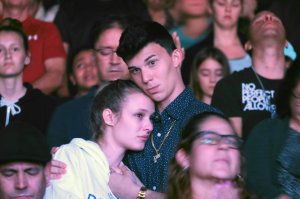 People attend a memorial service for victims of the shooting at Marjory Stoneman Douglas High School on Feb. 15, 2018 in Coral Springs, Florida. (Credit: Gaston De Cardenas / AFP / Getty Images)