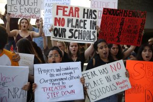 People join together after a school shooting that killed 17 to protest against guns on the steps of the Broward County Federal courthouse on Feb. 17, 2018 in Fort Lauderdale.(Credit: Joe Raedle/Getty Images)