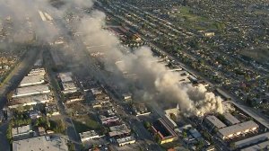 Smoke rises from an apartment building fire in Pico Rivera on Feb. 22, 2018. (Credit: KTLA)