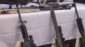 Part of a weapons cache seized at Steven Ponder's Temple City home is shown at a downtown L.A. news conference on Feb. 21, 2018. (Credit: KTLA)