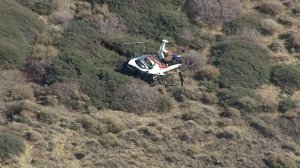 A downed helicopter is shown in an aerial photo from Sky5 on Feb. 1, 2018. (Credit: KTLA)