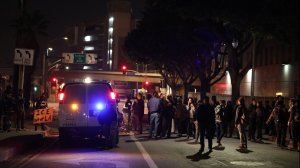 Immigrant rights activists block a Homeland Security van outside the Metropolitan Detention Center on Feb. 15, 2018. (Credit: Marcus Yam / Los Angeles Times)